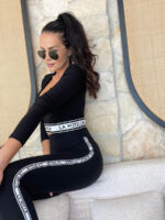 Czarne leginsy LaMilla z białym logowanym lampasem.