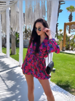 Kombinezon z gumką w pasie i troczkiem w kwiaty Lamilla.