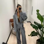 Szare spodnie z białym prążkiem LaMilla