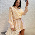 Kombinezon LaMilla w pomarańczowe paski