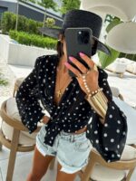 Czarna wiązana bluzka w białe groszki LaMilla