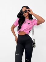 Czarne legginsy LaMilla z białym logo nad kolanami