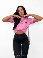 Czarne legginsy LaMilla z białym logo nad kolanami