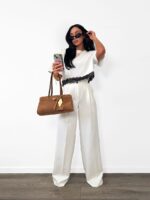Białe eleganckie spodnie LaMilla z szeroką nogawką na kantkę