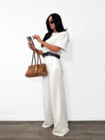 Białe eleganckie spodnie LaMilla z szeroką nogawką na kantkę