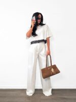 Białe eleganckie spodnie LaMilla z szeroką nogawką na kantkę