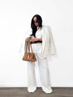 Białe eleganckie spodnie LaMilla z szeroką nogawką na kantkę